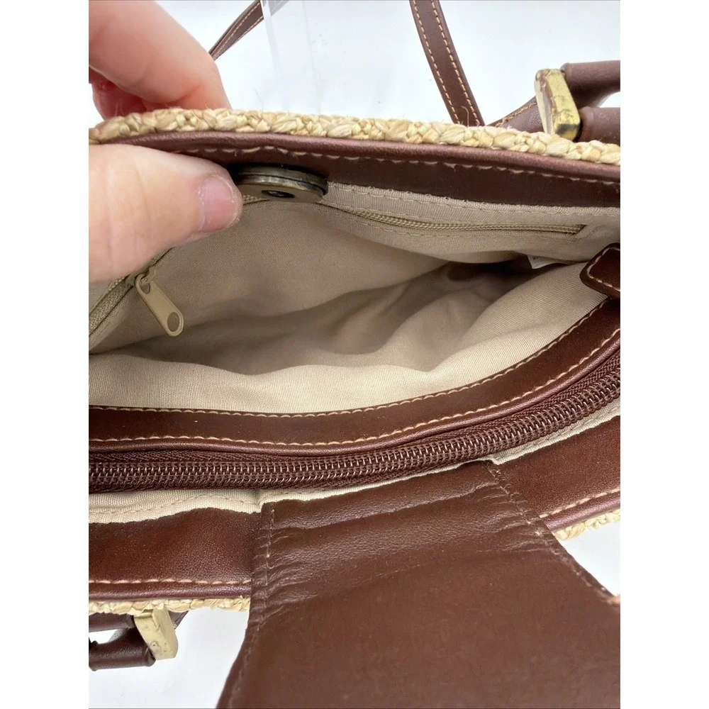 Rosetti straw tote handbag with brown faux leather trim‎ and top handles.